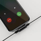 Baseus L46 Lightning splitter connected to iPhone with headphones and charger
