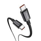 Baseus 100W black USB-C cable connected to laptop for fast charging