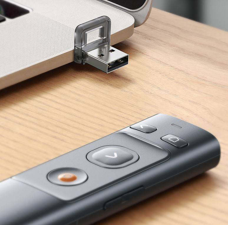 Baseus wireless presenter held in hand during office presentation