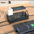 Hoco DC15 multi socket charger in use on desk