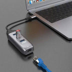 Onten 4-in-1 Type-C adapter connected to MacBook